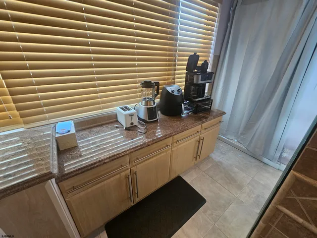 a bedroom with a bed and a mirror