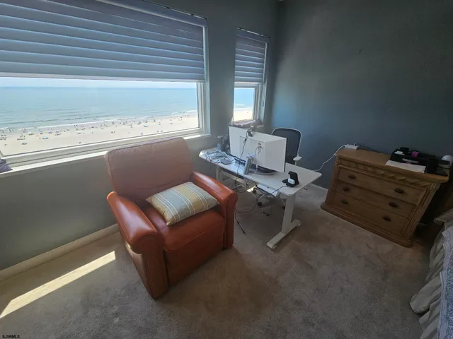 a bathroom with a sink vanity mirror and toilet