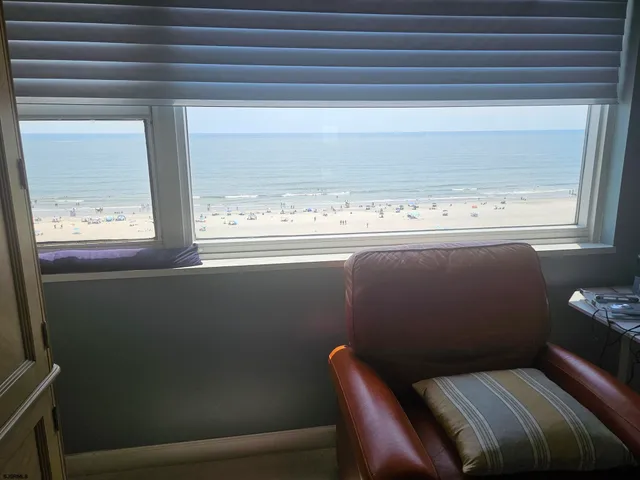 a bathroom with a shower and a glass door