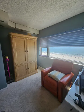 a living room with furniture and a mirror