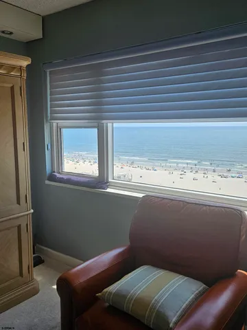a view of a livingroom with furniture and a window
