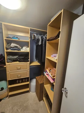 a view of a dining room with furniture and potted plant