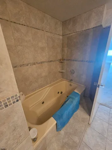 a view of a chairs and table in the balcony