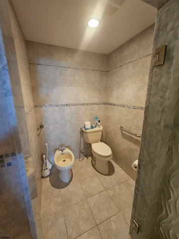 a view of a swimming pool with sitting area