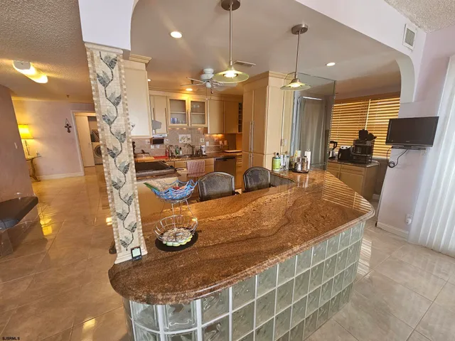 a view of a patio with table and chairs