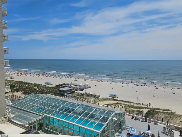 a view of a dining room with furniture and window