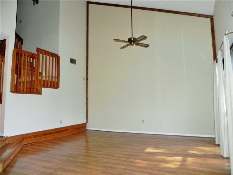 4183 Southwest 87th Terrace, Unit 4183 Davie, FL 33328 - Photo 14 of 34 a view of a room with wooden floor and cabinet