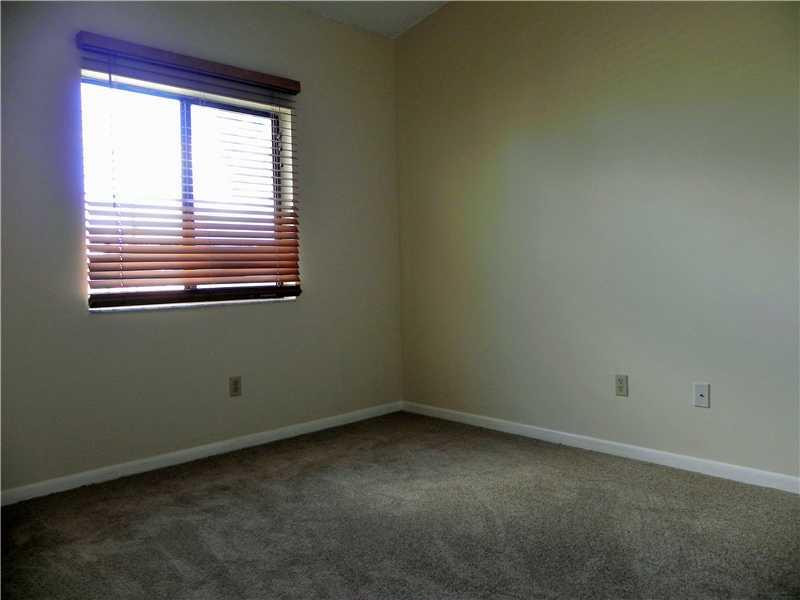 4183 Southwest 87th Terrace, Unit 4183 Davie, FL 33328 - Photo 15 of 34 an empty room with a window