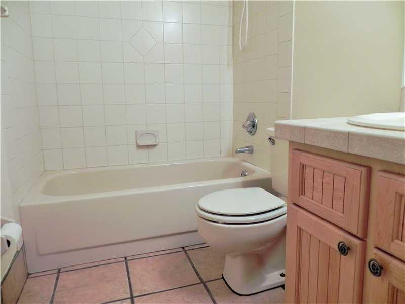 4183 Southwest 87th Terrace, Unit 4183 Davie, FL 33328 - Photo 17 of 34 a bathroom with a bathtub toilet and sink