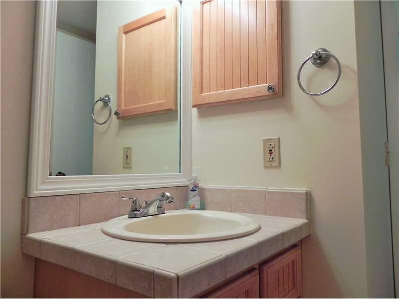 4183 Southwest 87th Terrace, Unit 4183 Davie, FL 33328 - Photo 18 of 34 a bathroom with a sink and a mirror