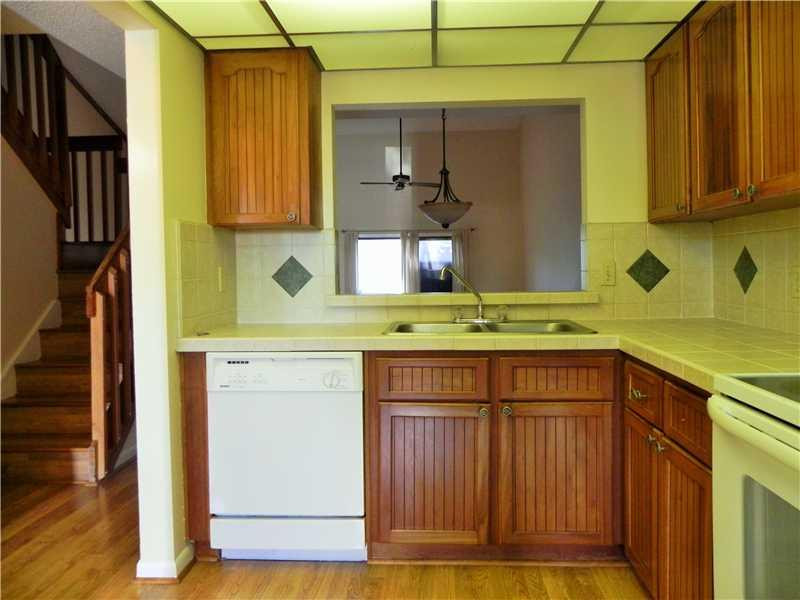 4183 Southwest 87th Terrace, Unit 4183 Davie, FL 33328 - Photo 2 of 34 a kitchen with a sink and cabinets