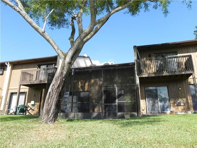 4183 Southwest 87th Terrace, Unit 4183 Davie, FL 33328 - Photo 24 of 34 a view of a house with a yard