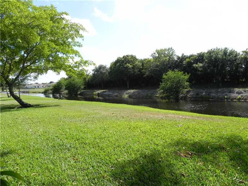 4183 Southwest 87th Terrace, Unit 4183 Davie, FL 33328 - Photo 25 of 34 a view of outdoor space with deck and yard
