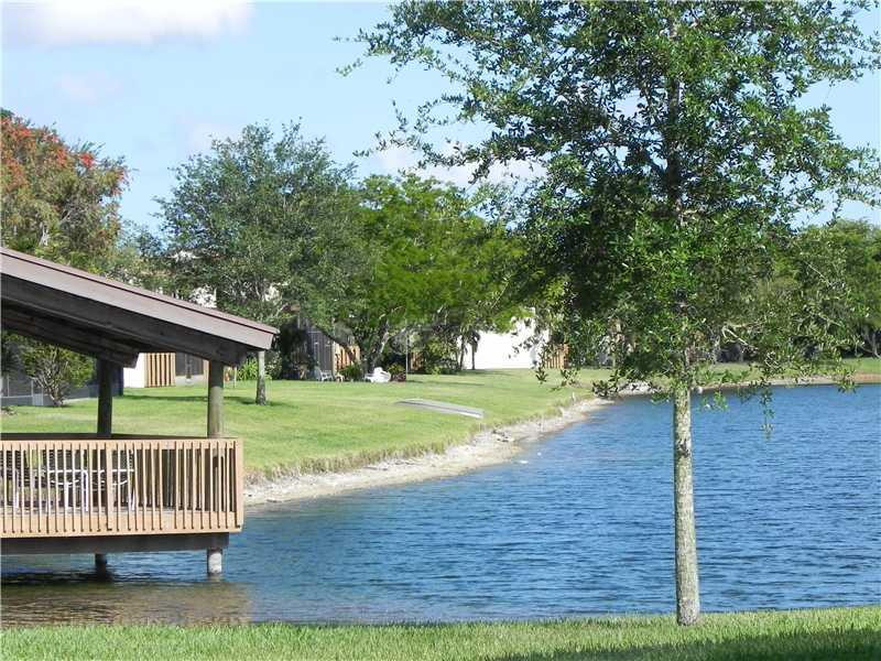 4183 Southwest 87th Terrace, Unit 4183 Davie, FL 33328 - Photo 29 of 34 a view of outdoor space with deck and yard