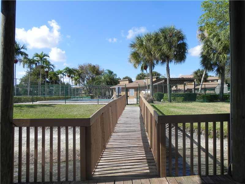 4183 Southwest 87th Terrace, Unit 4183 Davie, FL 33328 - Photo 33 of 34 a view of swimming pool from a lake