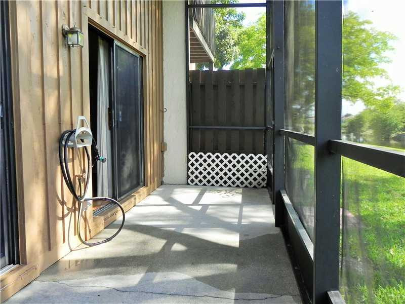 4183 Southwest 87th Terrace, Unit 4183 Davie, FL 33328 - Photo 7 of 34 a view of a door and chair in the balcony