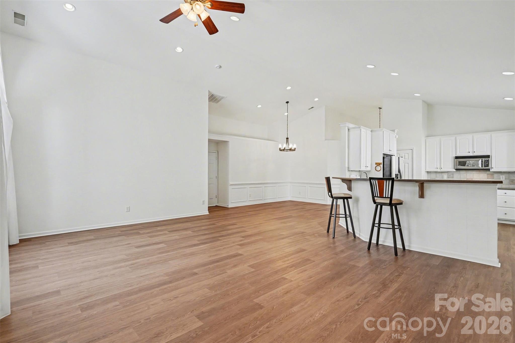 977 Platinum Drive Fort Mill, SC 29708 - Photo 12 of 41 a view of kitchen with cabinets and wooden floor