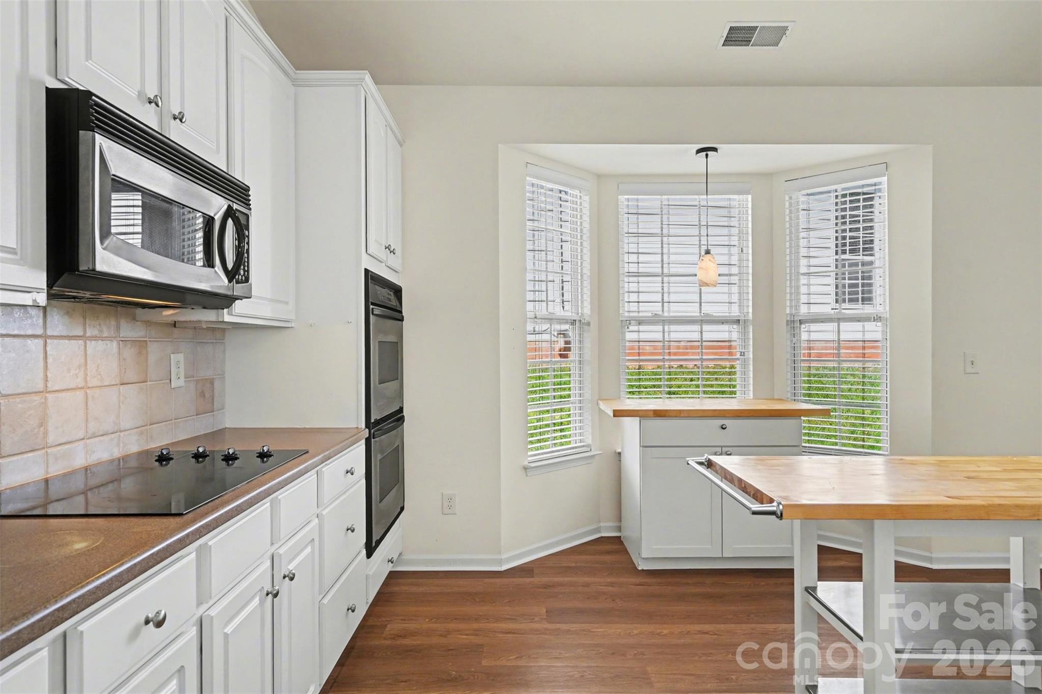 977 Platinum Drive Fort Mill, SC 29708 - Photo 15 of 41 a kitchen with stainless steel appliances granite countertop a stove a sink and a microwave