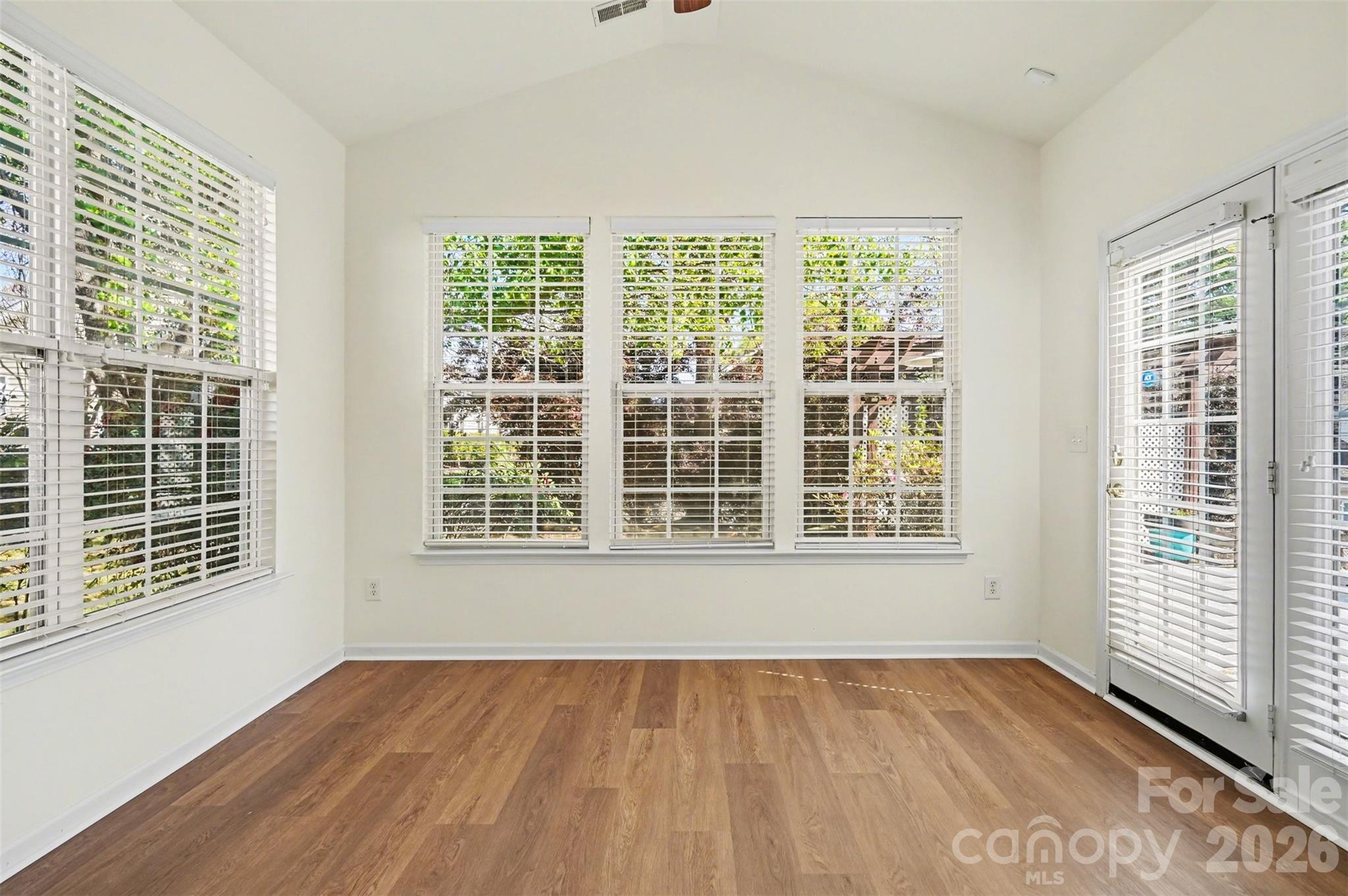977 Platinum Drive Fort Mill, SC 29708 - Photo 16 of 41 a view of an empty room with wooden floor and a window