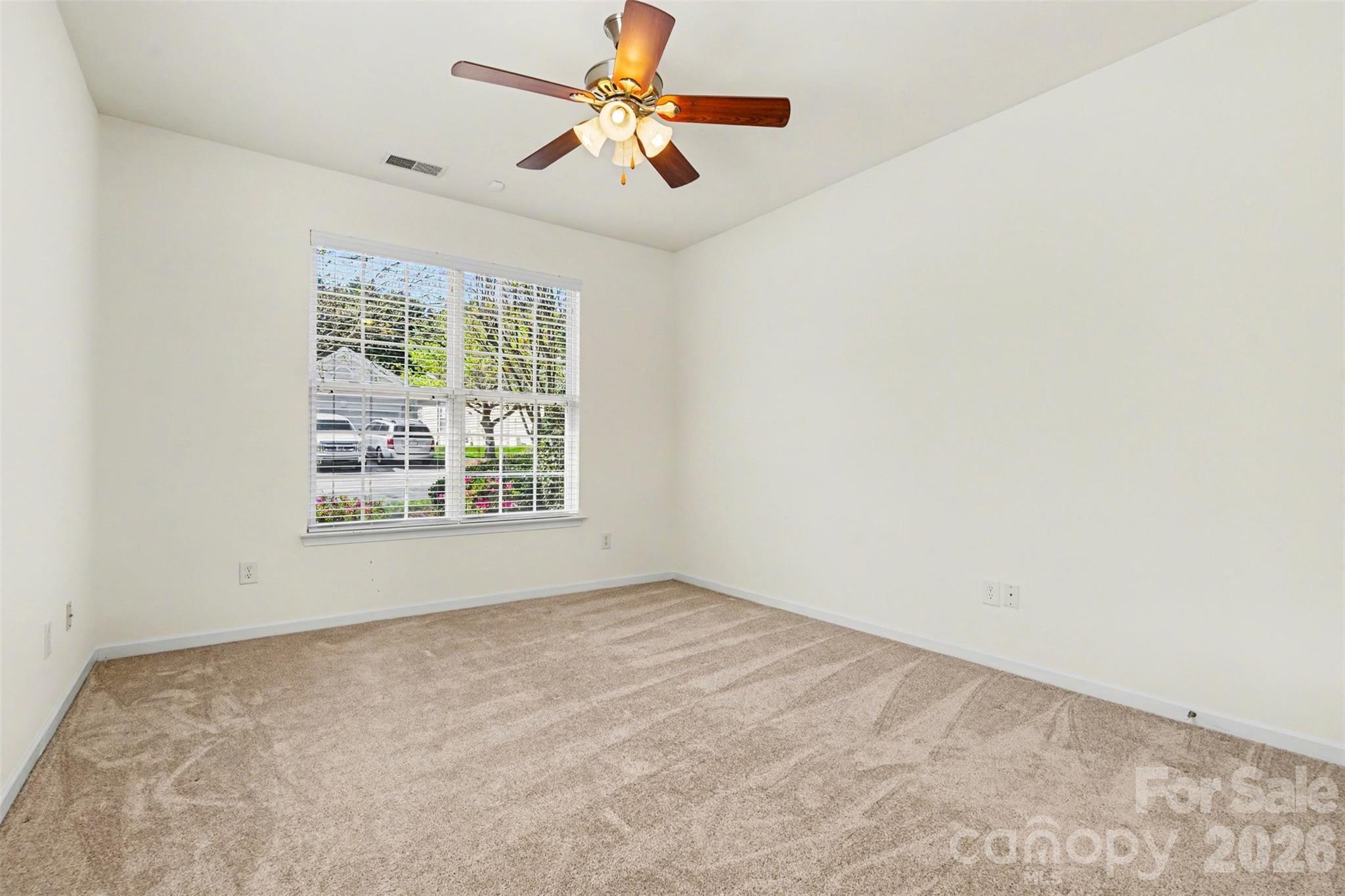 977 Platinum Drive Fort Mill, SC 29708 - Photo 19 of 41 an empty room with a window and a fan
