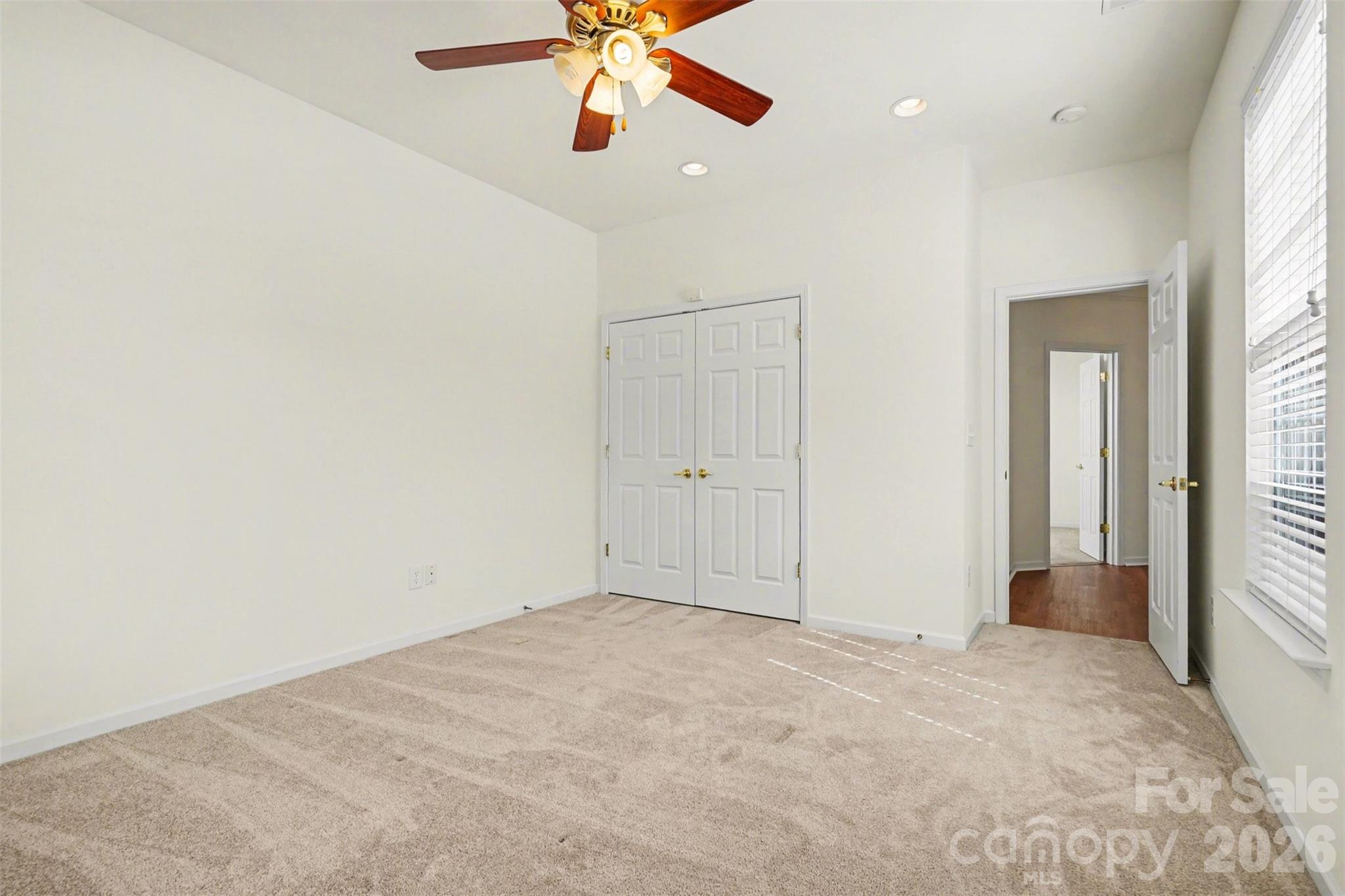 977 Platinum Drive Fort Mill, SC 29708 - Photo 20 of 41 an empty room with ceiling fan and window