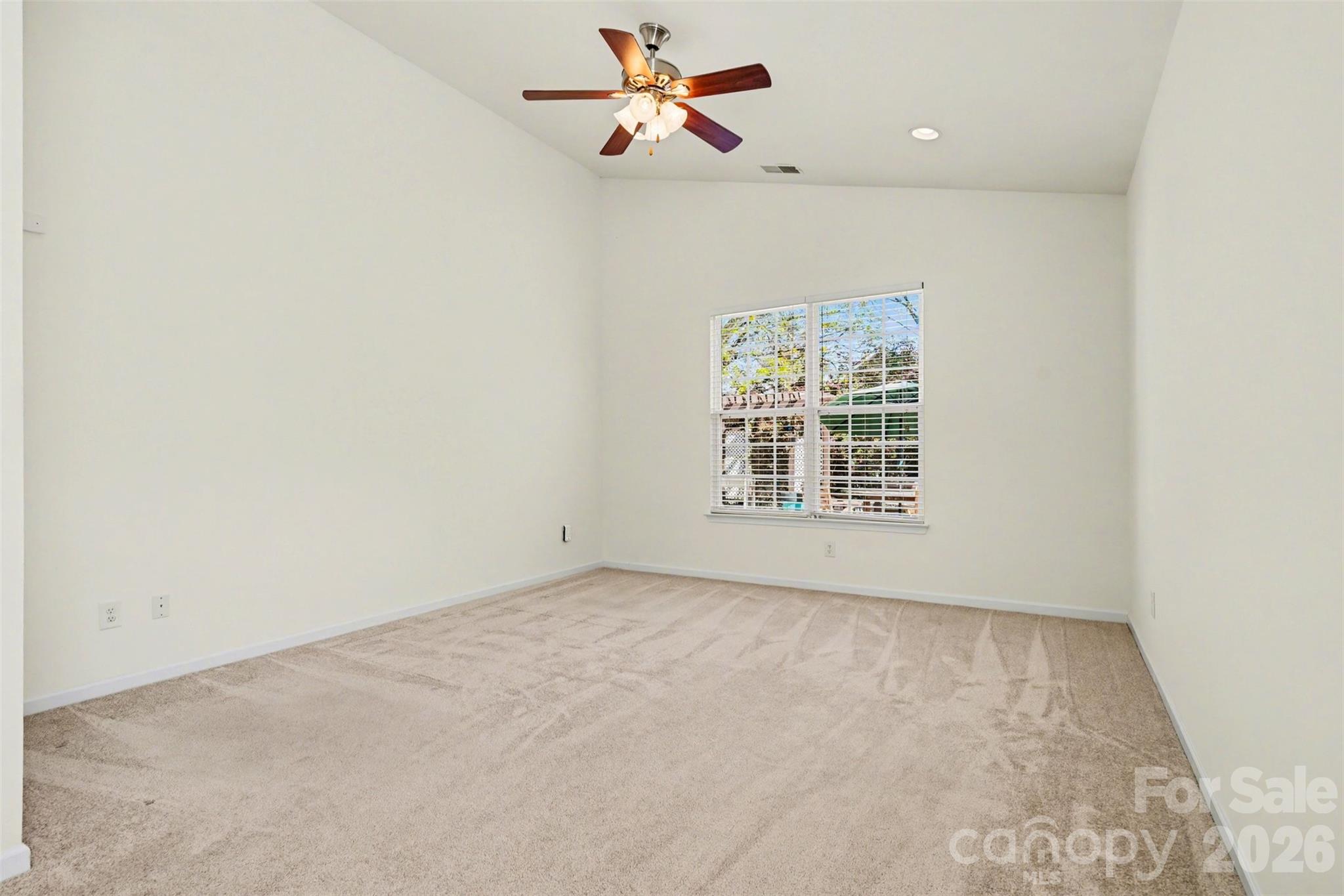 977 Platinum Drive Fort Mill, SC 29708 - Photo 25 of 41 an empty room with windows and fan