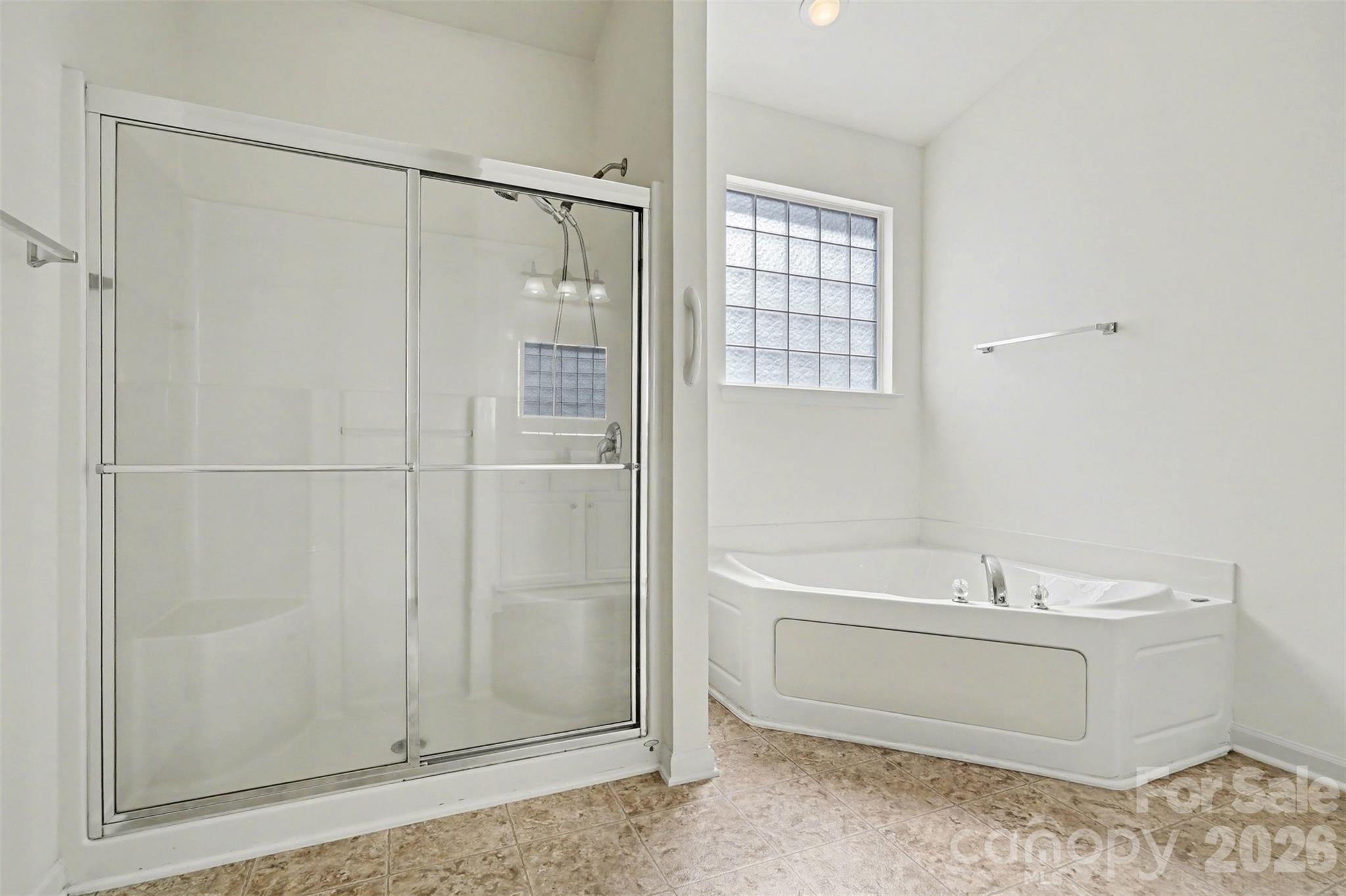 977 Platinum Drive Fort Mill, SC 29708 - Photo 28 of 41 a bathroom with a shower a sink and a mirror