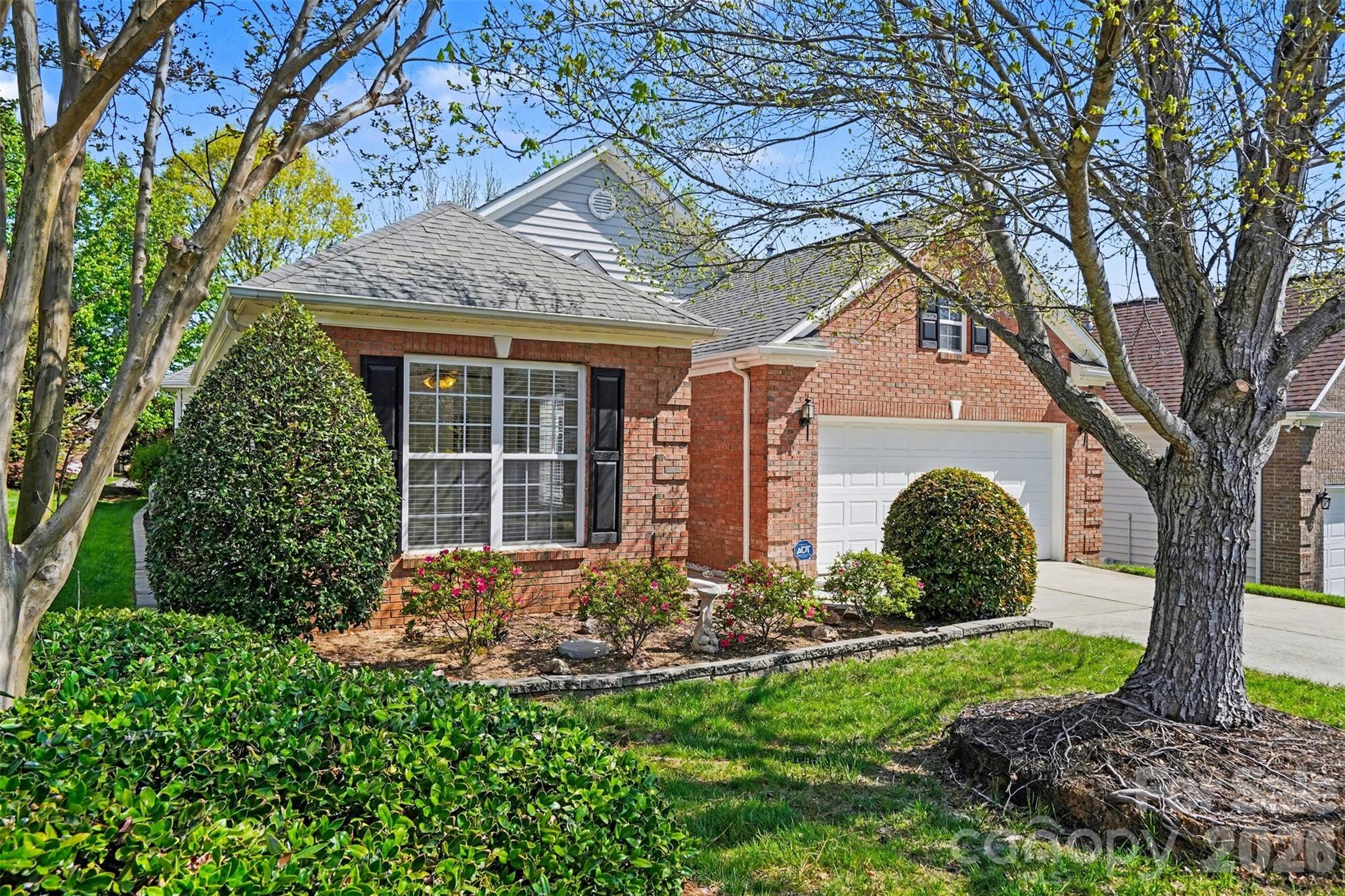 977 Platinum Drive Fort Mill, SC 29708 - Photo 3 of 41 a front view of a house with garden