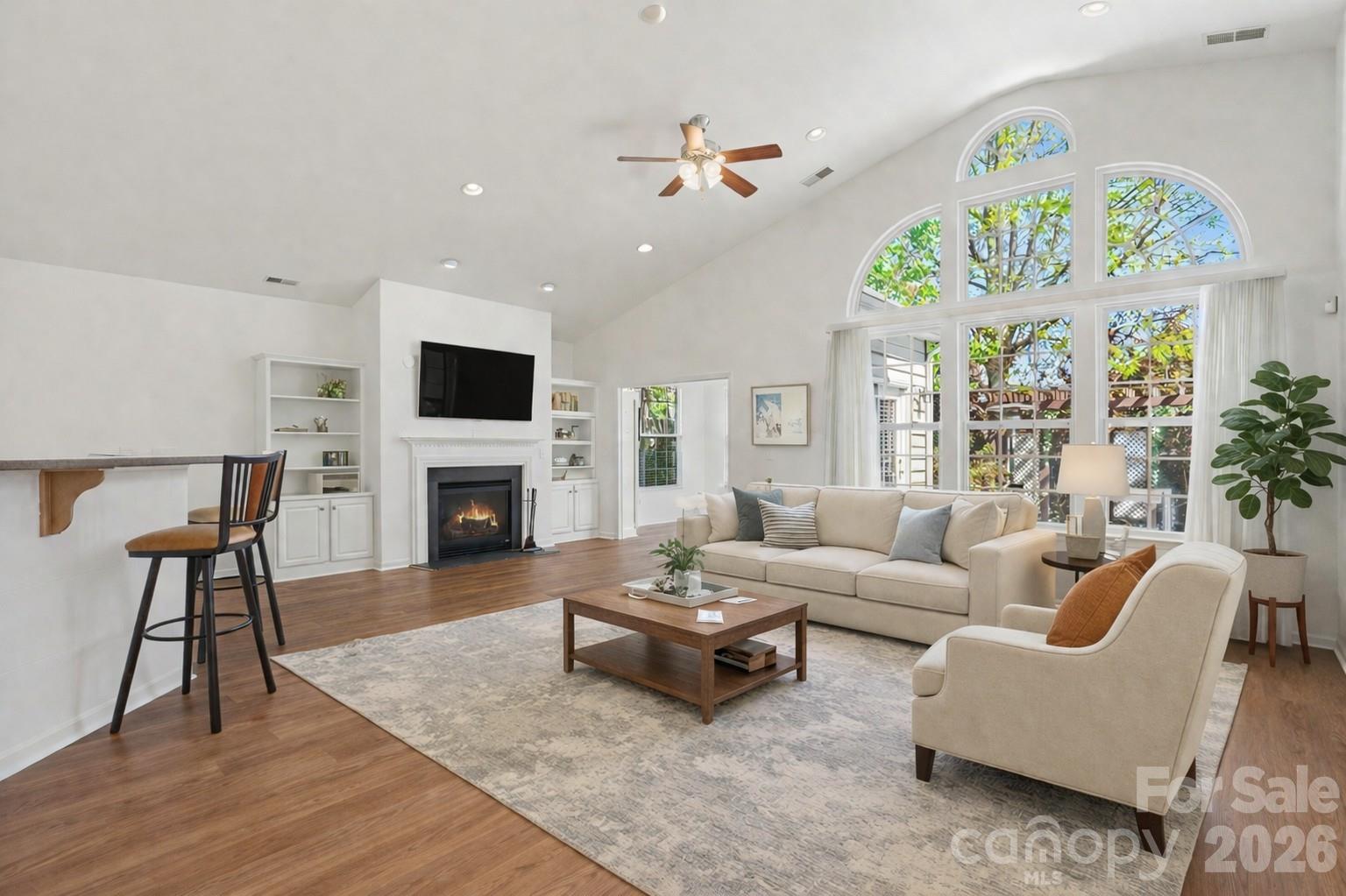 977 Platinum Drive Fort Mill, SC 29708 - Photo 6 of 41 a living room with furniture a fireplace and a flat screen tv