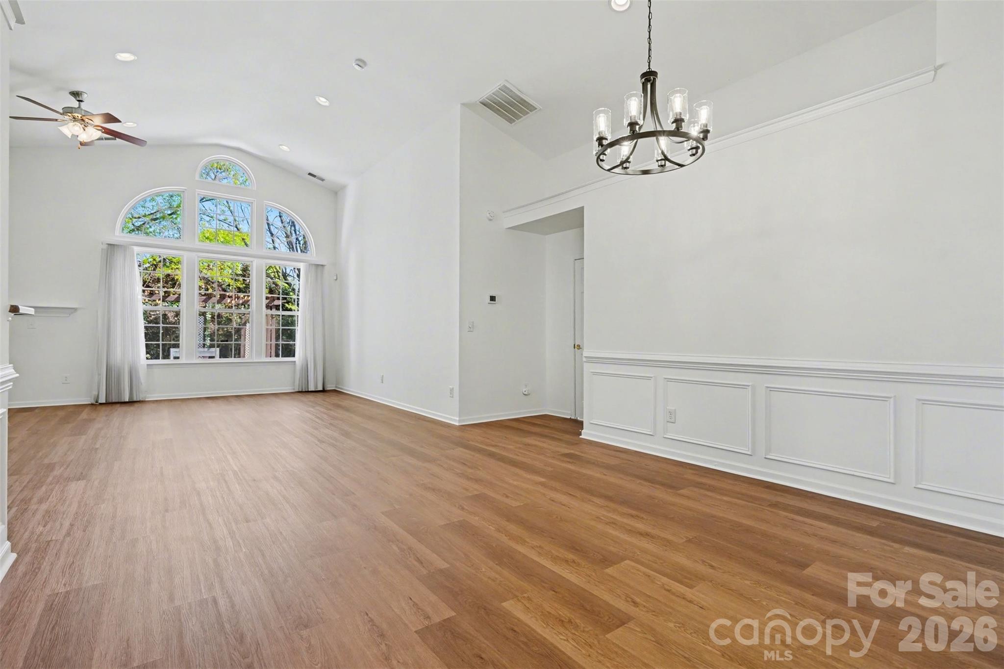 977 Platinum Drive Fort Mill, SC 29708 - Photo 9 of 41 wooden floor in an empty room with a window