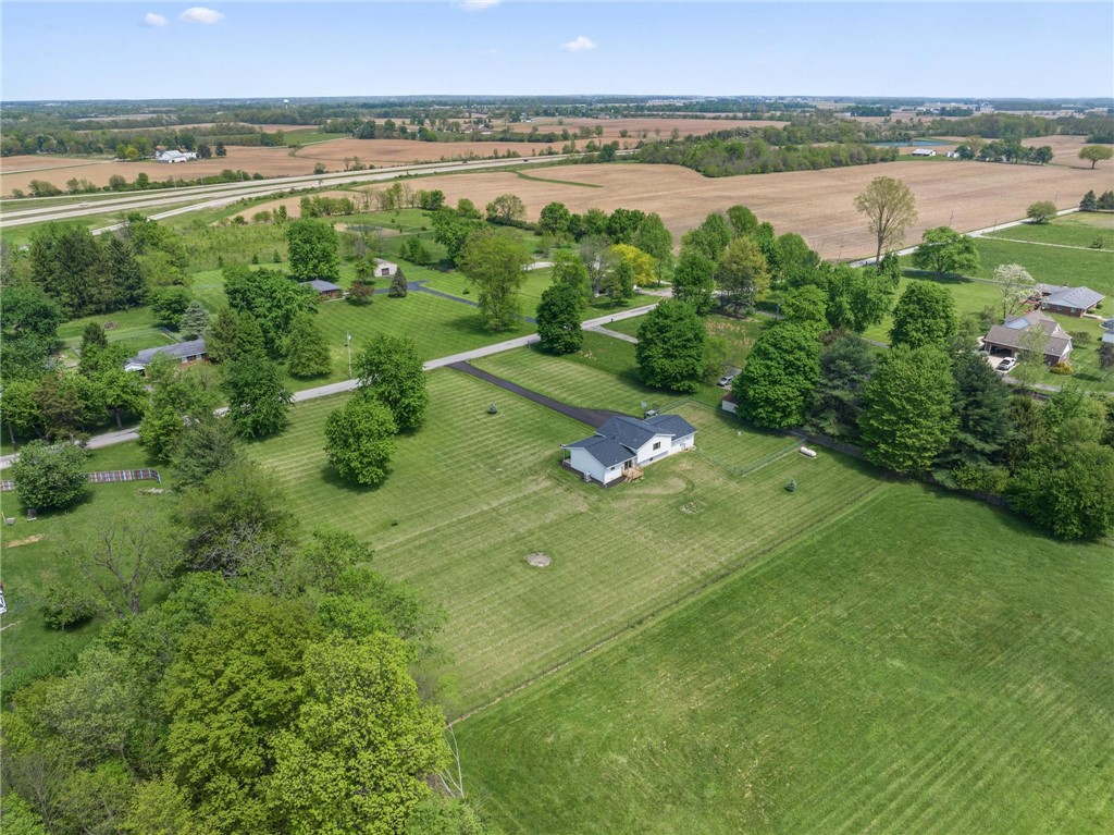 1353 Foust Road Xenia, OH 45385 - Photo 14 of 50 This elevated view captures the extensive grounds surrounding the residence, offering a serene landscape.