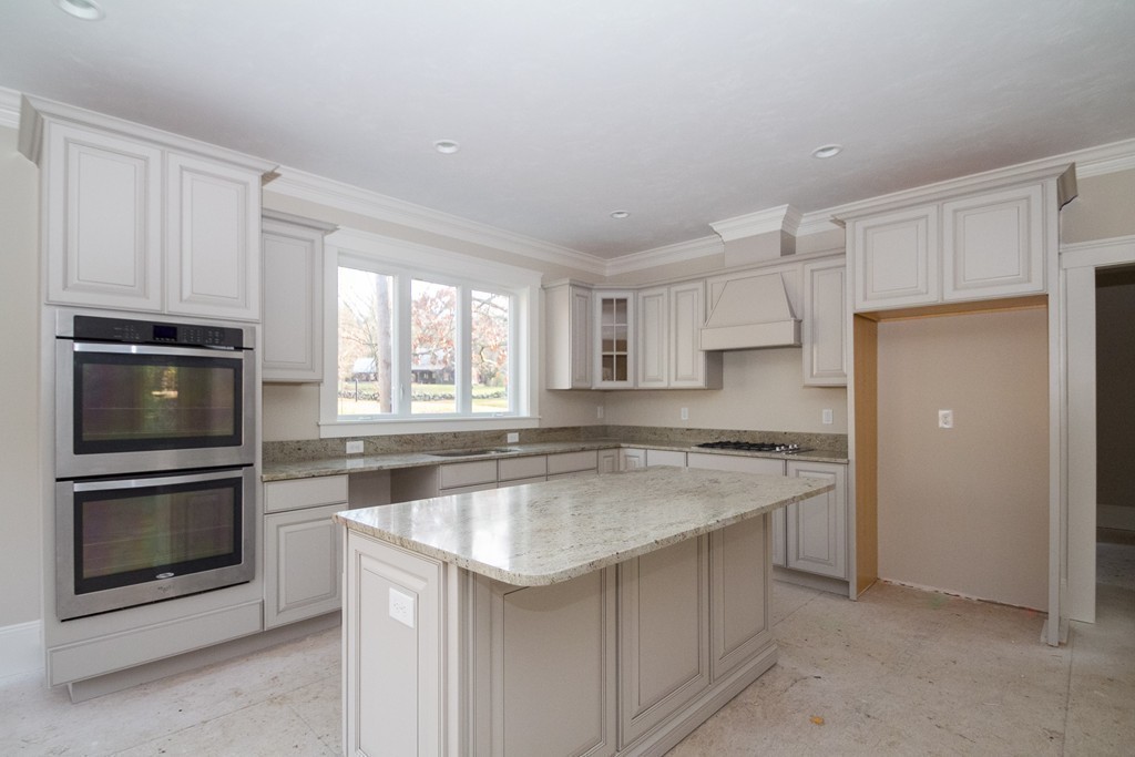 27 Birch Road Littleton, MA 01460 - Photo 12 of 22 a kitchen with a stove a sink and a microwave