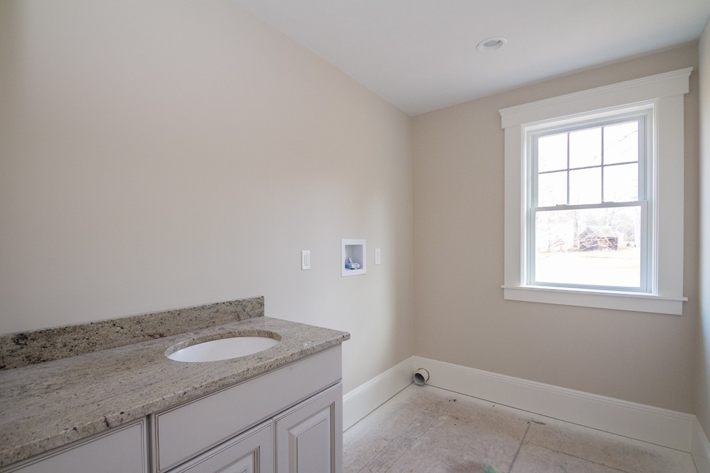 27 Birch Road Littleton, MA 01460 - Photo 21 of 22 a bathroom with a granite countertop sink and window