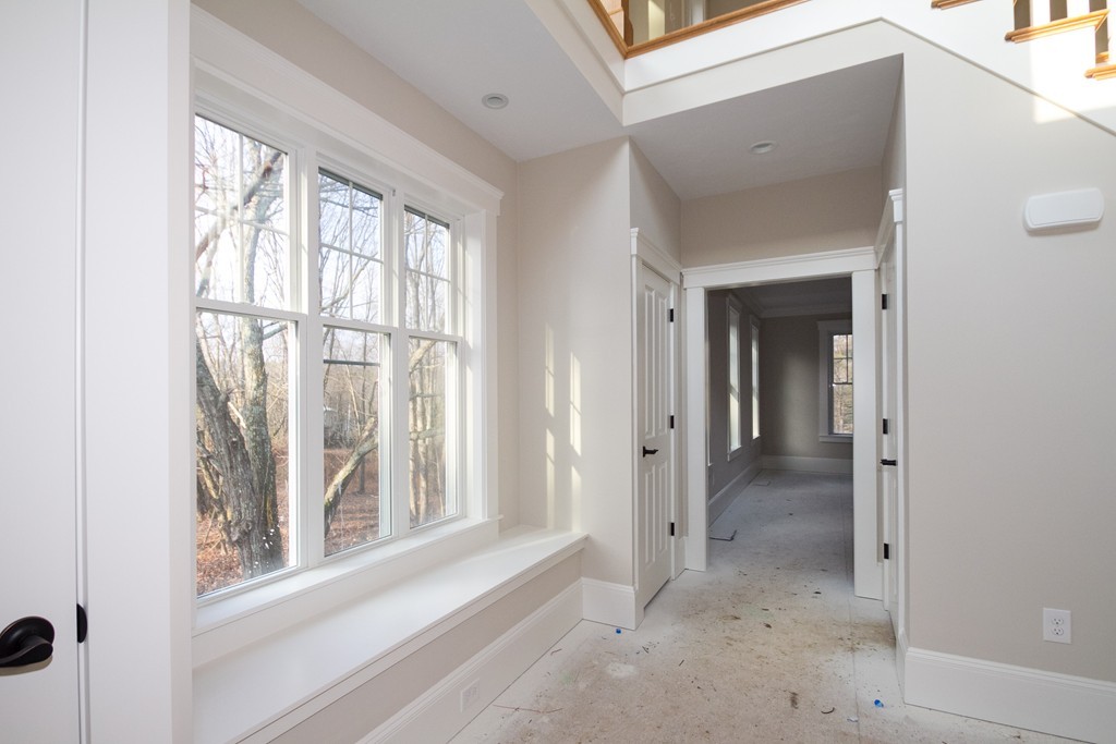 27 Birch Road Littleton, MA 01460 - Photo 9 of 22 a view of a bathroom with a glass door and a window