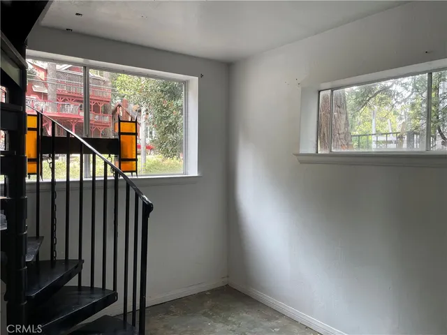 an empty room with closet area