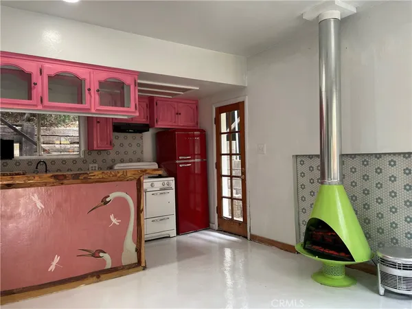 a room with cabinets and wooden floor