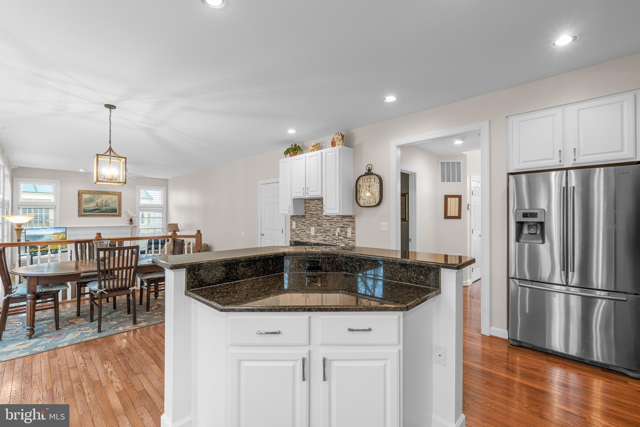 4615 Brightwood Road Olney, MD 20832 - Photo 11 of 45 a kitchen with stainless steel appliances granite countertop a sink a stove and a refrigerator