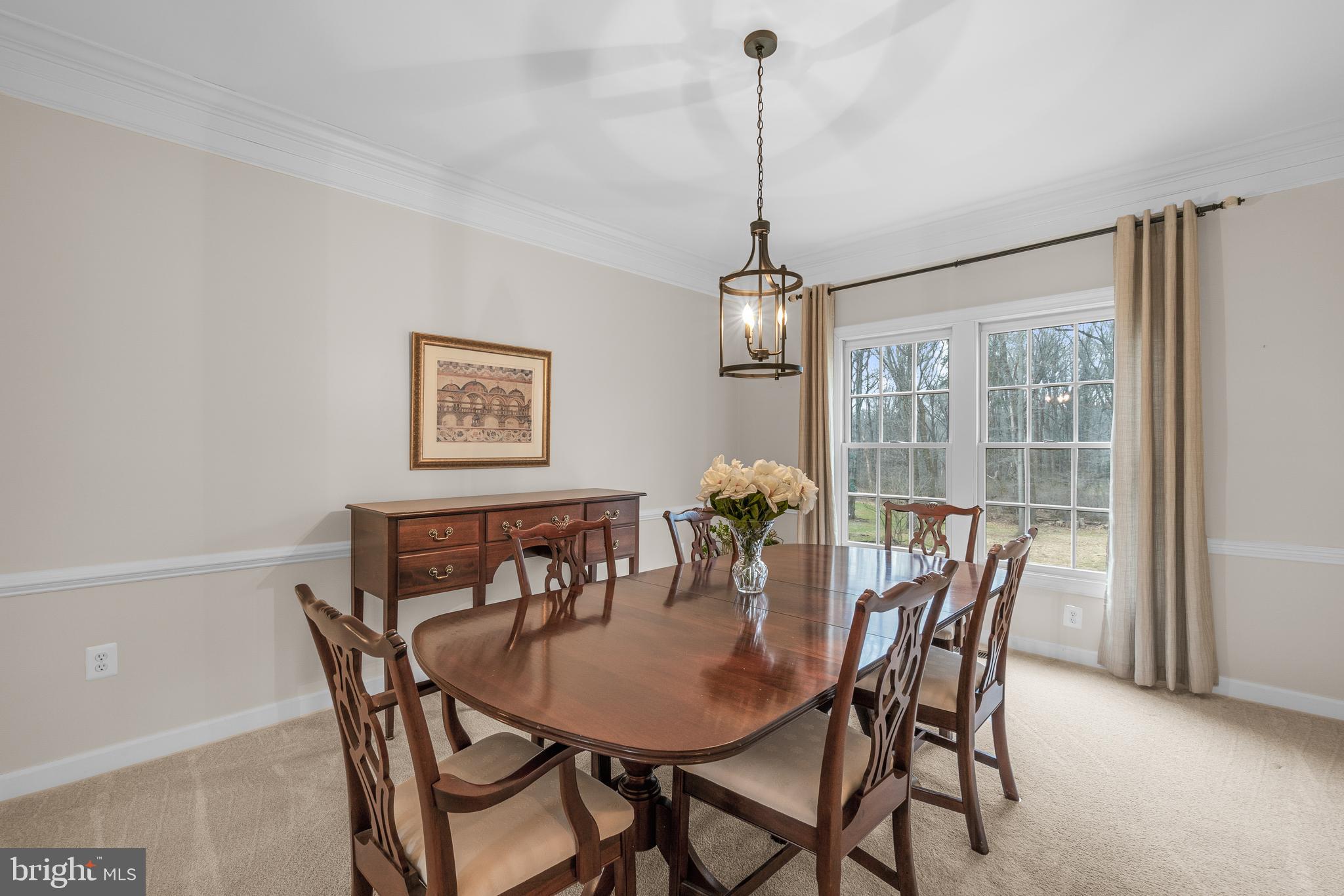 4615 Brightwood Road Olney, MD 20832 - Photo 14 of 45 a view of a dining room and a table and chairs