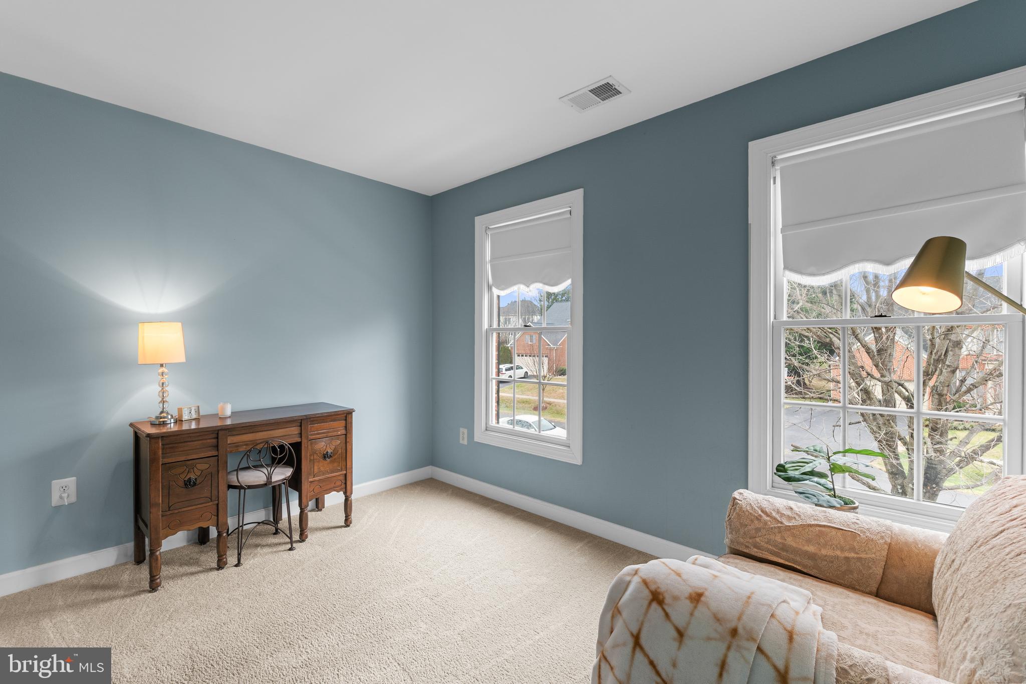 4615 Brightwood Road Olney, MD 20832 - Photo 24 of 45 a living room with furniture and a window