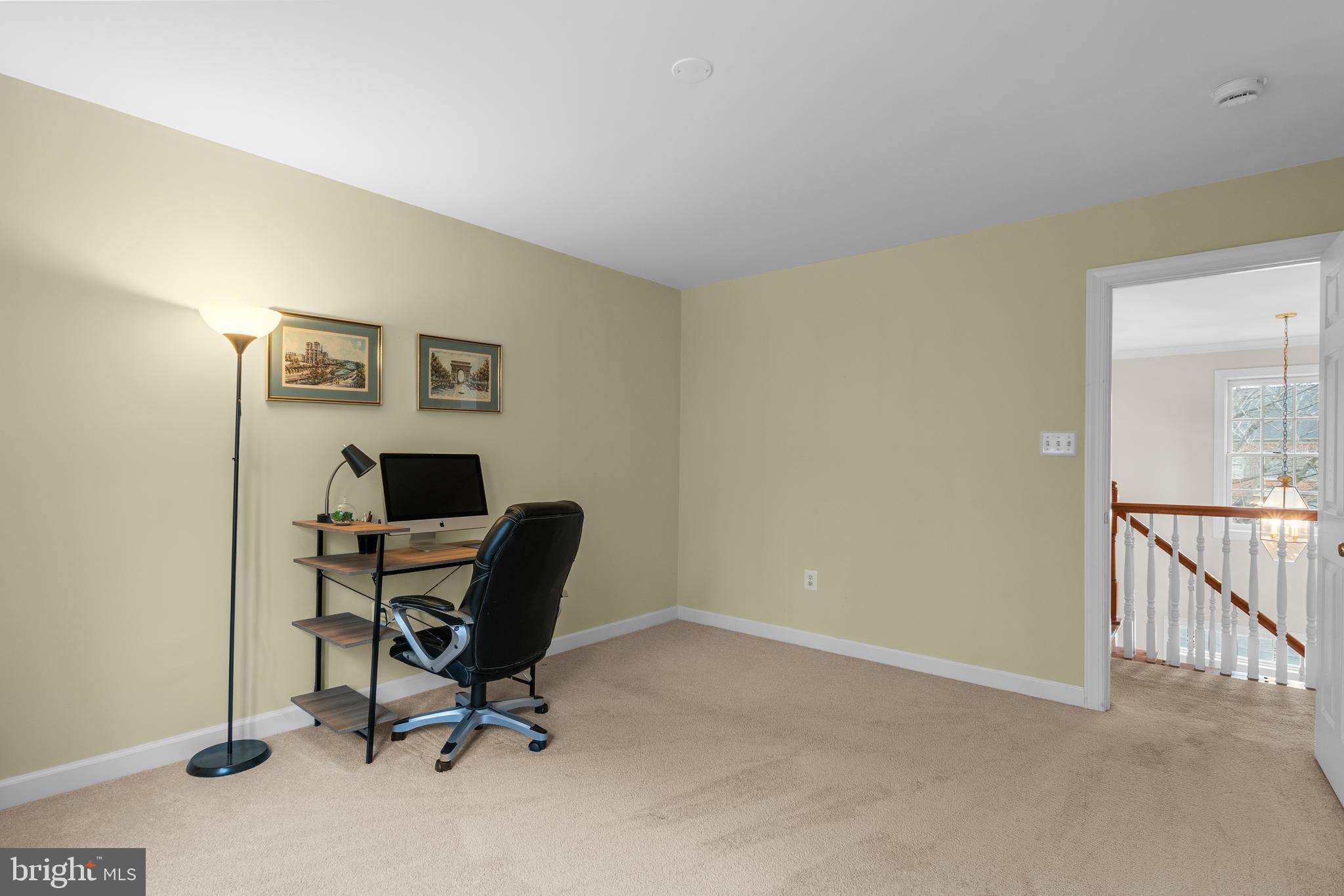 4615 Brightwood Road Olney, MD 20832 - Photo 26 of 45 a view of a workspace with furniture and a window