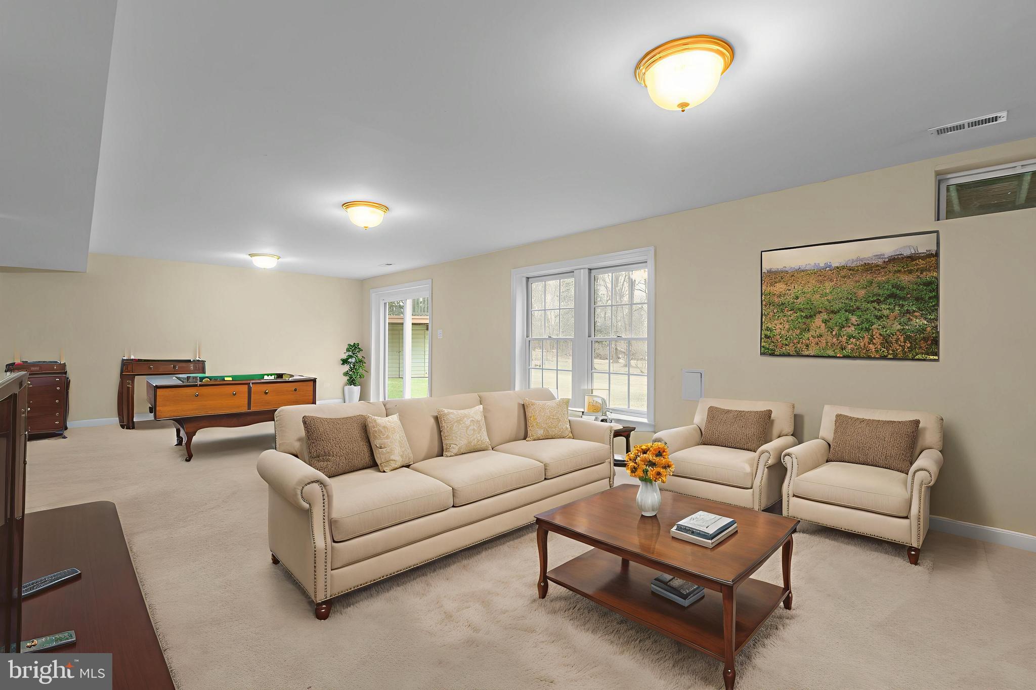 4615 Brightwood Road Olney, MD 20832 - Photo 38 of 45 a living room with furniture and a large window