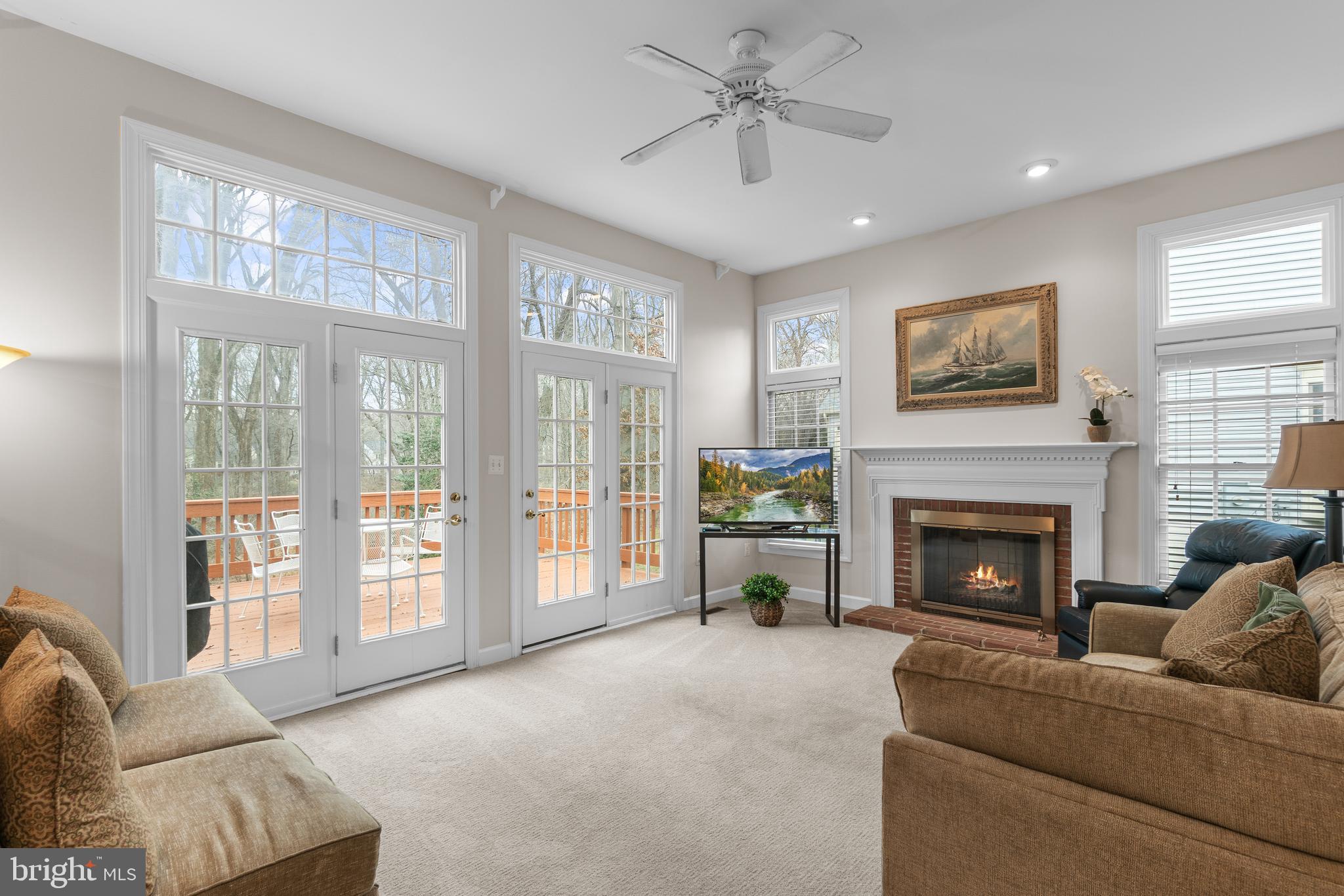4615 Brightwood Road Olney, MD 20832 - Photo 5 of 45 a living room with furniture and a fireplace