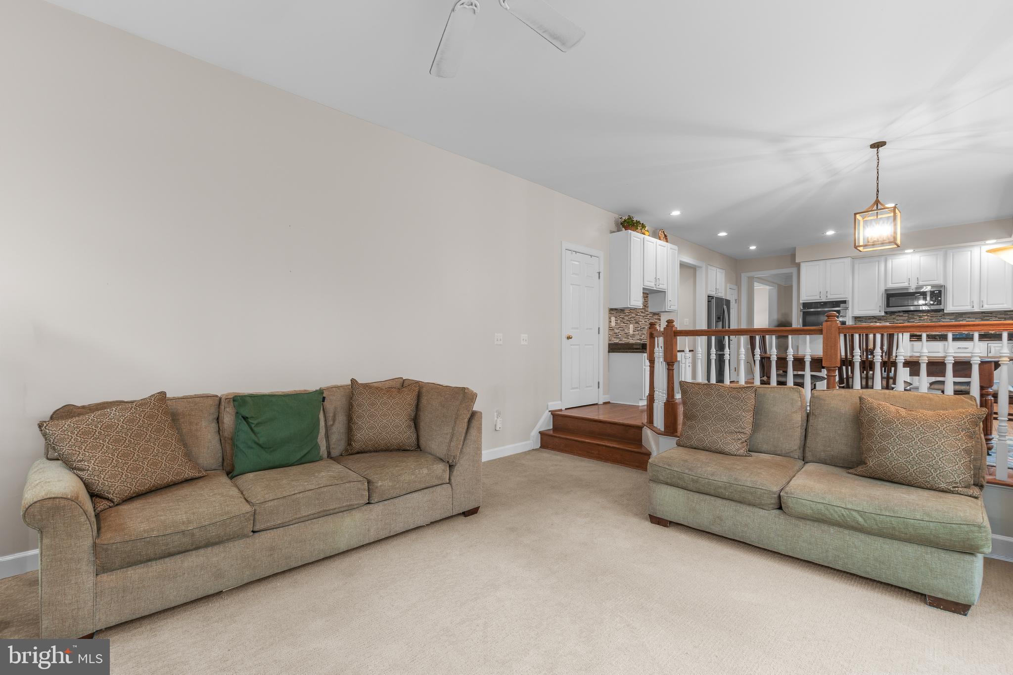 4615 Brightwood Road Olney, MD 20832 - Photo 7 of 45 a living room with furniture and kitchen view
