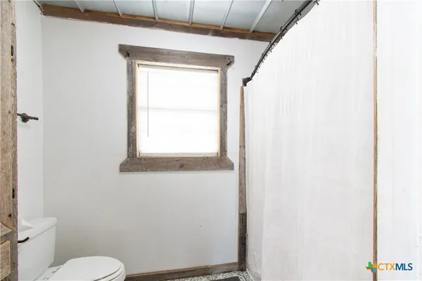a bathroom with a granite countertop sink a mirror and a vanity