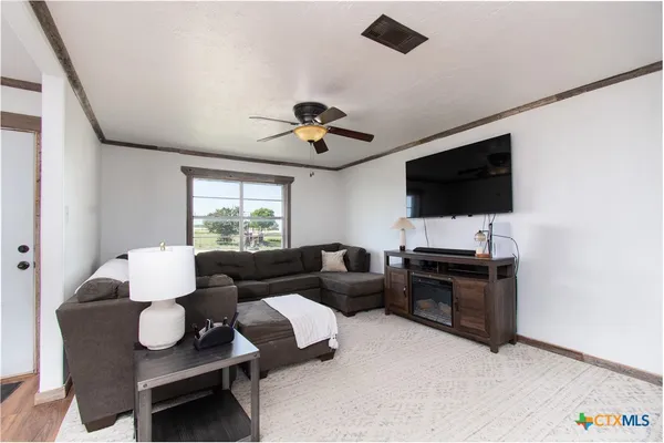 a living room with furniture and a window