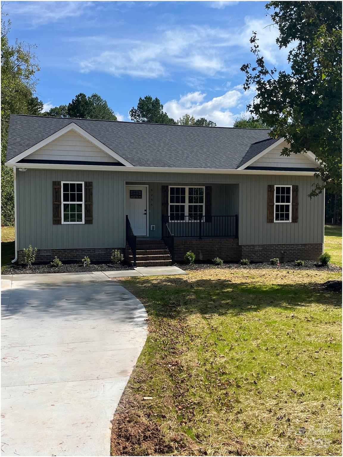 front view of a house with a yard