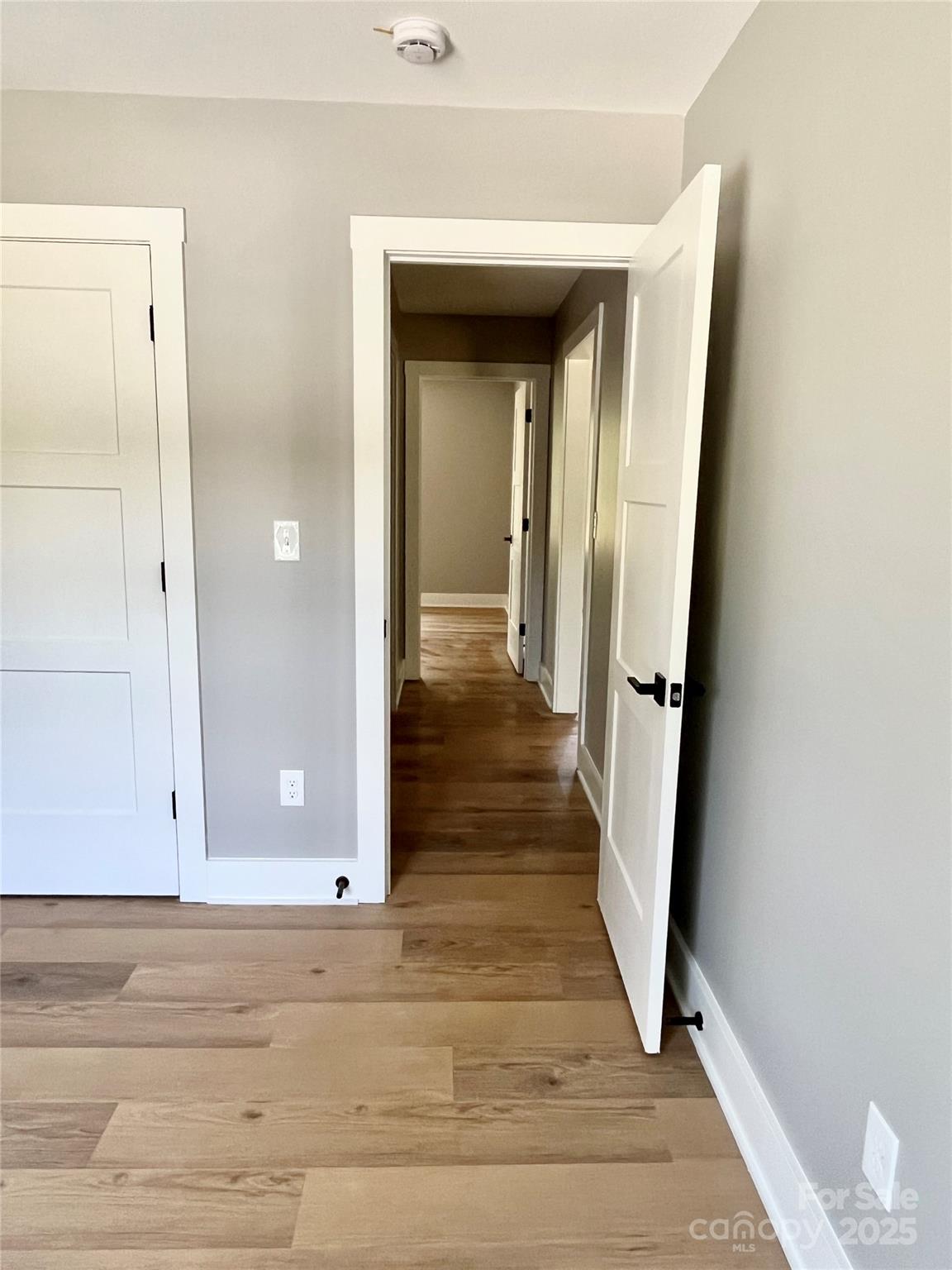 6255 Old Salisbury Road Linwood, NC 27299 - Photo 17 of 21 a view of a hallway with wooden floor and closet