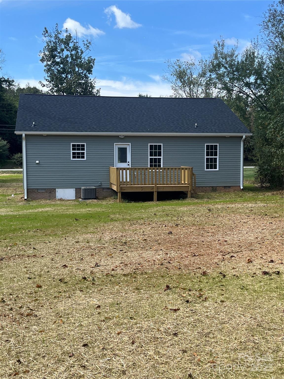 6255 Old Salisbury Road Linwood, NC 27299 - Photo 21 of 21 a house with a tree in front of the house