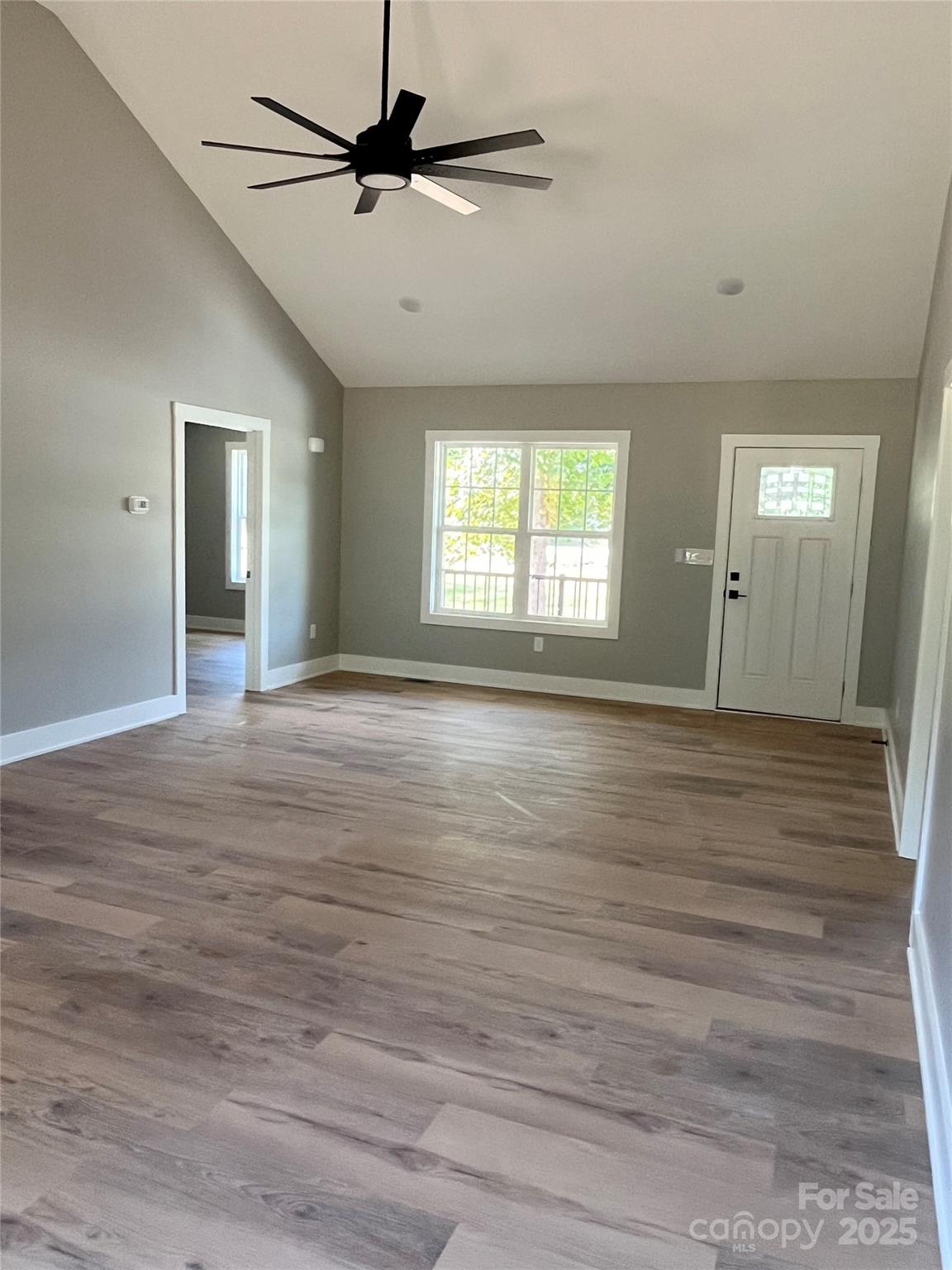 6255 Old Salisbury Road Linwood, NC 27299 - Photo 4 of 21 a view of an empty room with window and wooden floor