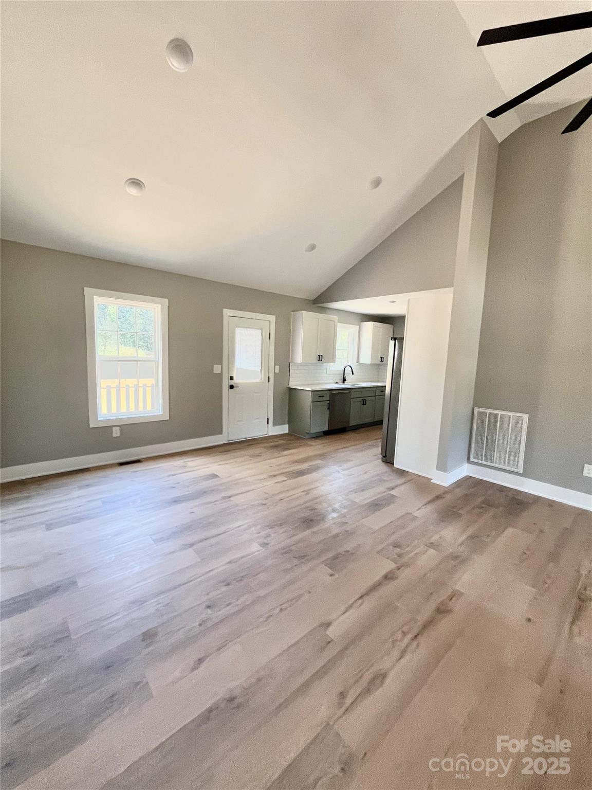 6255 Old Salisbury Road Linwood, NC 27299 - Photo 5 of 21 a view of empty room with wooden floor and fan